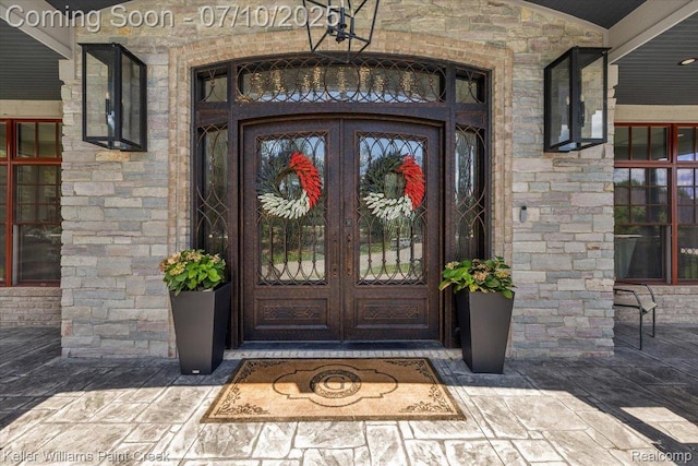 6295 Canter Creek Trl, Grand Blanc, MI 48439 - property entrance featuring french doors and stone siding