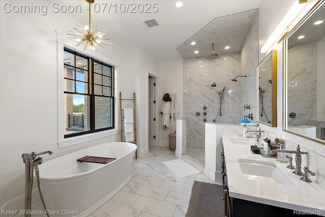 6295 Canter Creek Trl, Grand Blanc, MI 48439 - bathroom featuring marble finish flooring, a marble finish shower, a freestanding tub, double vanity, and recessed lighting
