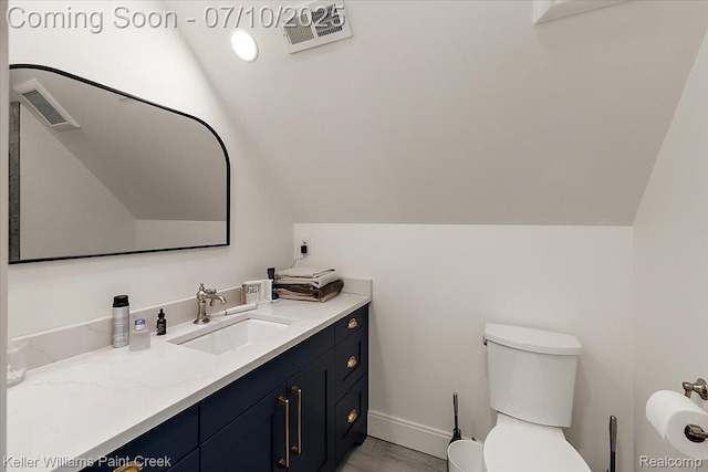 6295 Canter Creek Trl, Grand Blanc, MI 48439 - bathroom featuring vanity, lofted ceiling, and wood finished floors