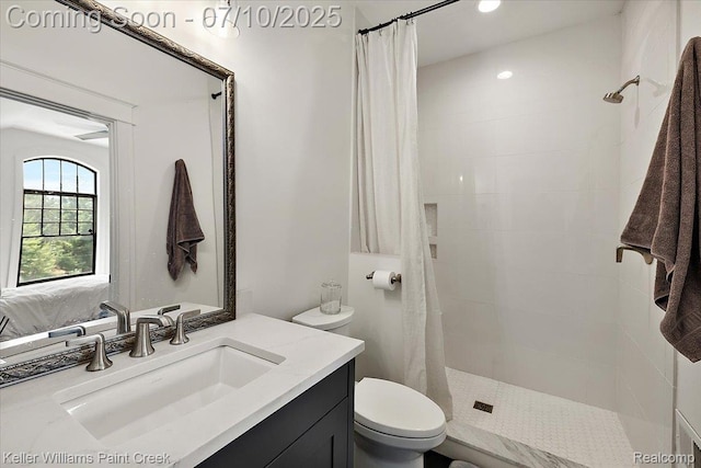 6295 Canter Creek Trl, Grand Blanc, MI 48439 - bathroom featuring vanity, tiled shower, and connected bathroom