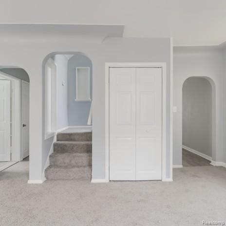 440 Jewell St, Southfield, MI 48220 - staircase featuring arched walkways and carpet floors