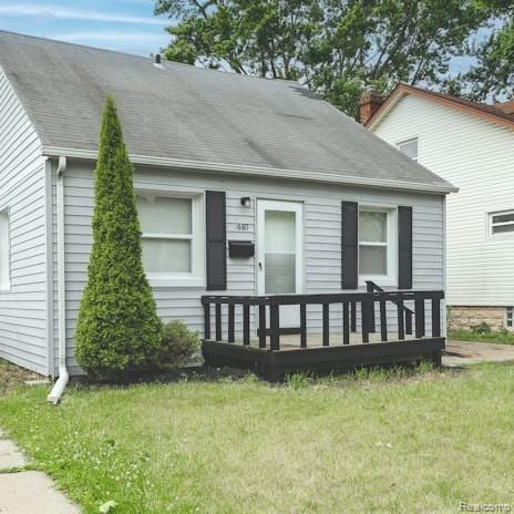 440 Jewell St, Southfield, MI 48220 - view of front of home featuring a front lawn, a chimney, and a shingled roof