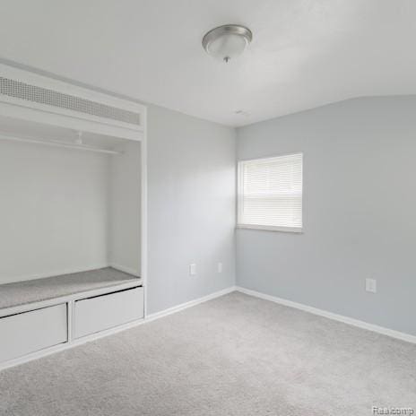 440 Jewell St, Southfield, MI 48220 - unfurnished bedroom featuring carpet and vaulted ceiling