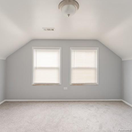 440 Jewell St, Southfield, MI 48220 - additional living space with vaulted ceiling, carpet floors, and healthy amount of natural light