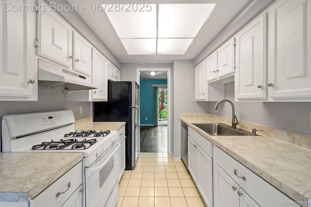 1481 Oakbrook E, Rochester, MI 48307 - kitchen with appliances with stainless steel finishes, under cabinet range hood, white cabinets, light tile patterned flooring, and light countertops