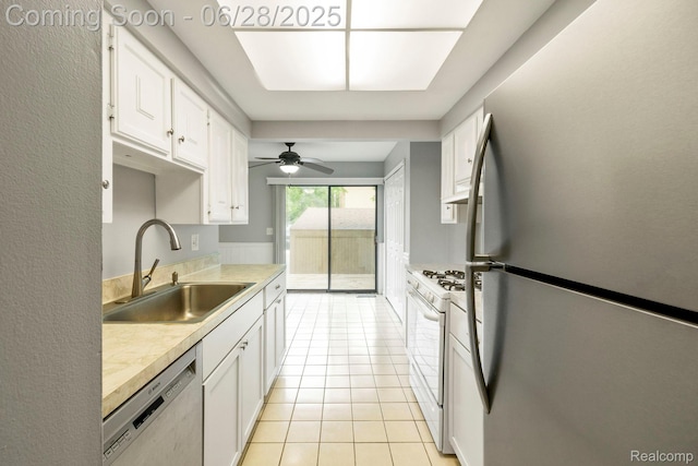 1481 Oakbrook E, Rochester, MI 48307 - kitchen with stainless steel appliances, white cabinets, light countertops, ceiling fan, and light tile patterned floors