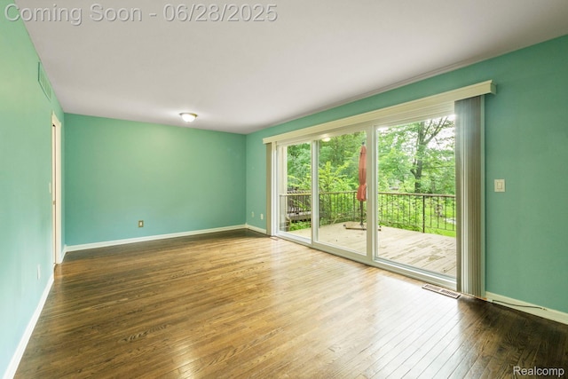 1481 Oakbrook E, Rochester, MI 48307 - unfurnished room featuring healthy amount of natural light and hardwood / wood-style flooring