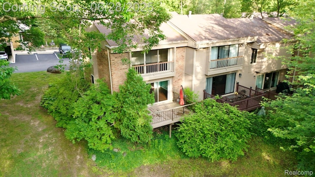 1481 Oakbrook E, Rochester, MI 48307 - rear view of property with brick siding and a balcony