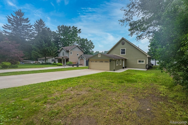 2624 Lynch, Highland, MI 48357 - view of home's exterior featuring concrete driveway, a garage, and a lawn