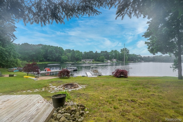 2624 Lynch, Highland, MI 48357 - dock area featuring a water view, a yard, and an outdoor fire pit