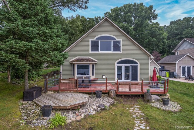 2624 Lynch, Highland, MI 48357 - rear view of property featuring a yard, french doors, a wooden deck, and a patio