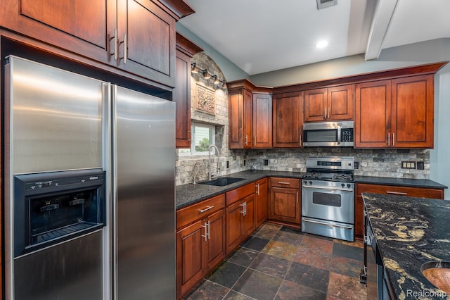 2624 Lynch, Highland, MI 48357 - kitchen with stainless steel appliances, decorative backsplash, stone finish floors, recessed lighting, and dark stone counters