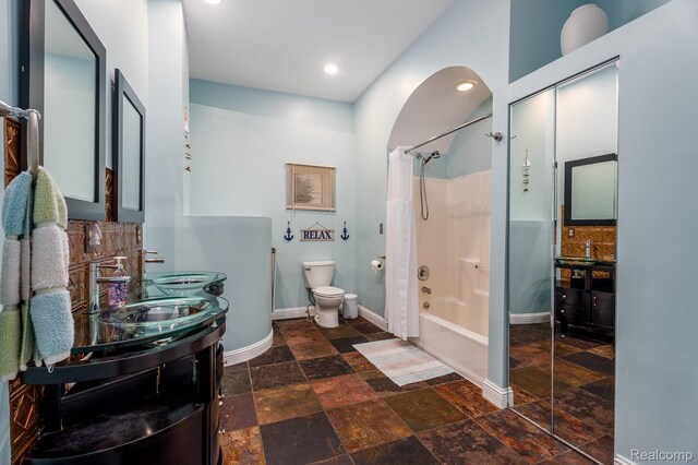 2624 Lynch, Highland, MI 48357 - bathroom with stone tile floors, shower / tub combo, vanity, and recessed lighting