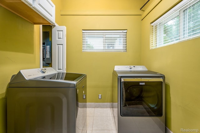 2624 Lynch, Highland, MI 48357 - laundry room with washing machine and dryer, healthy amount of natural light, and light tile patterned flooring