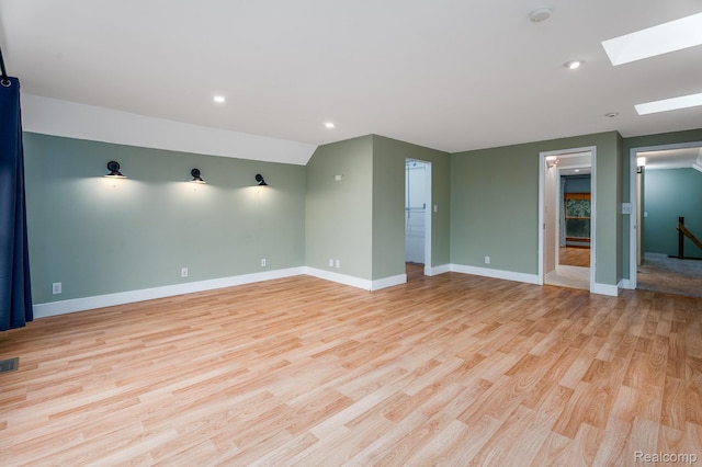 2624 Lynch, Highland, MI 48357 - unfurnished room with a skylight, light wood-type flooring, recessed lighting, and a smoke detector