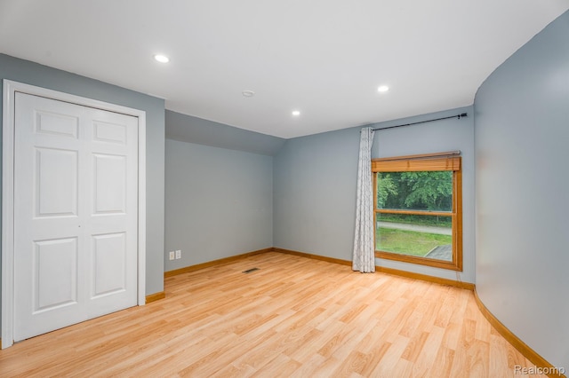 2624 Lynch, Highland, MI 48357 - unfurnished bedroom featuring wood finished floors, recessed lighting, and vaulted ceiling