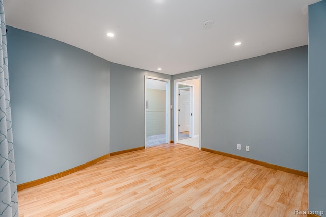 2624 Lynch, Highland, MI 48357 - spare room featuring wood finished floors and recessed lighting