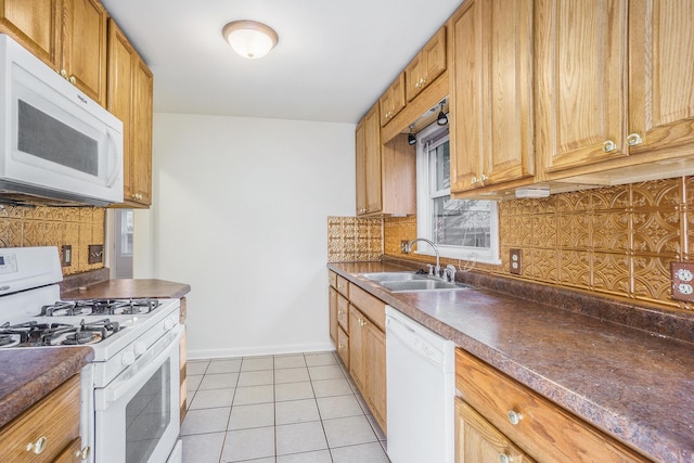 1315 Sutherland Ave, Kalamazoo, MI 49006 - kitchen featuring white appliances, decorative backsplash, dark countertops, and light tile patterned floors