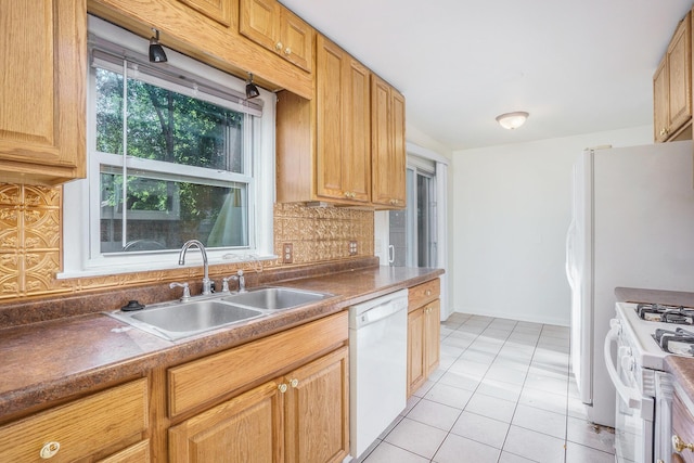 1315 Sutherland Ave, Kalamazoo, MI 49006 - kitchen featuring white appliances, tasteful backsplash, light tile patterned floors, and dark countertops