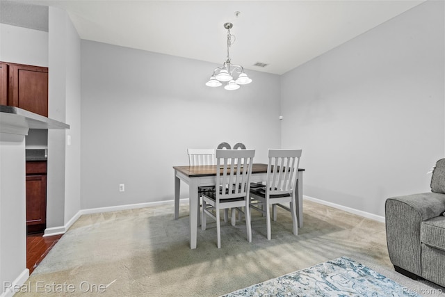 28836 Cullen Dr Unit 10, Romulus, MI 48174 - dining room featuring light colored carpet and a chandelier
