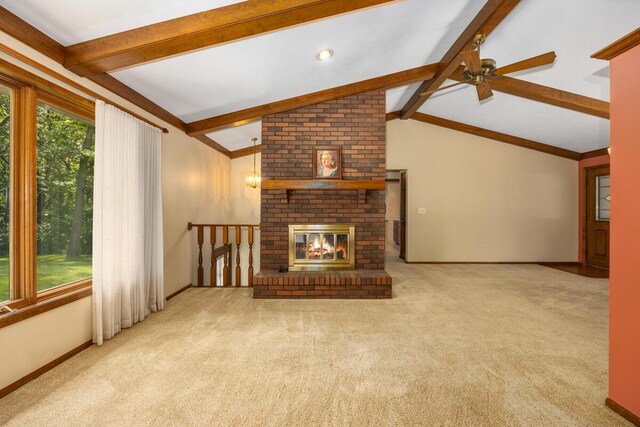 2360 Montclair Ave NW, Walker, MI 49544 - unfurnished living room with a ceiling fan, carpet, and a fireplace