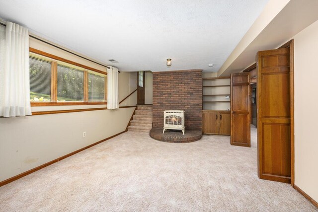 2360 Montclair Ave NW, Walker, MI 49544 - unfurnished living room with heating unit, carpet floors, and stairway
