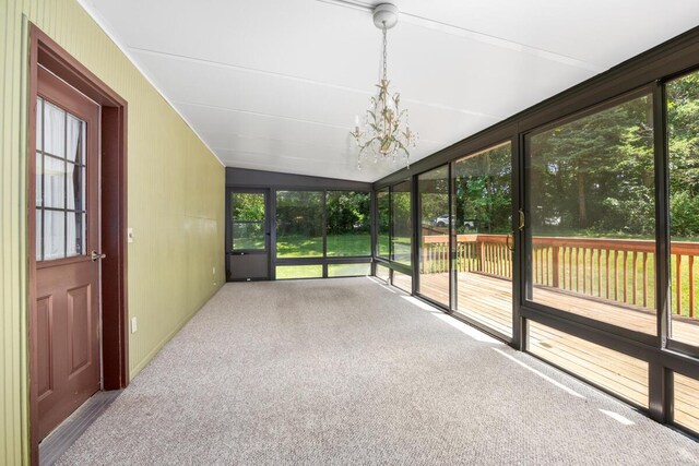 2360 Montclair Ave NW, Walker, MI 49544 - unfurnished sunroom with a chandelier, healthy amount of natural light, and vaulted ceiling