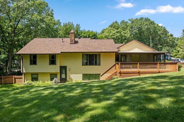 2360 Montclair Ave NW, Walker, MI 49544 - rear view of property featuring a chimney, roof with shingles, and a deck