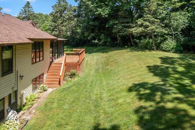 2360 Montclair Ave NW, Walker, MI 49544 - view of green lawn featuring stairway and a deck