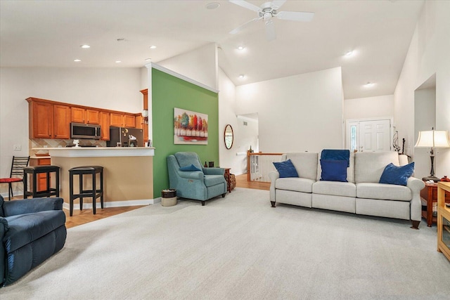7520 Haflinger Cir, Kalamazoo, MI 49009 - living area featuring high vaulted ceiling, ceiling fan, light colored carpet, and recessed lighting