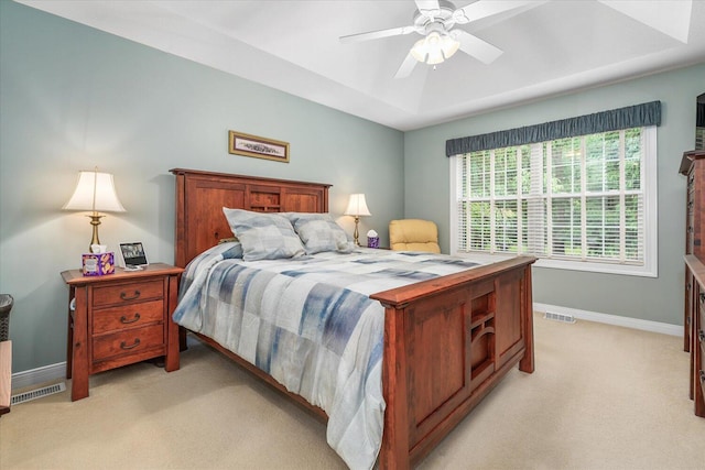 7520 Haflinger Cir, Kalamazoo, MI 49009 - bedroom featuring light carpet, ceiling fan, and a raised ceiling