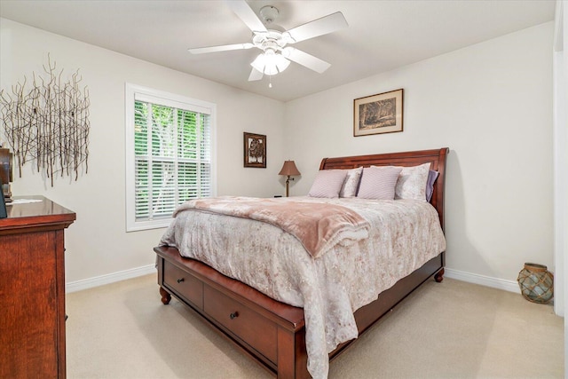7520 Haflinger Cir, Kalamazoo, MI 49009 - bedroom with light carpet and a ceiling fan