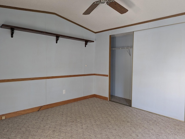 1310 Windridge Ln, Fremont, MI 49412 - unfurnished bedroom with lofted ceiling, carpet floors, a closet, and ceiling fan
