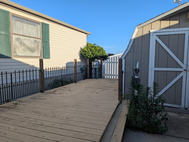 1310 Windridge Ln, Fremont, MI 49412 - wooden terrace featuring a shed
