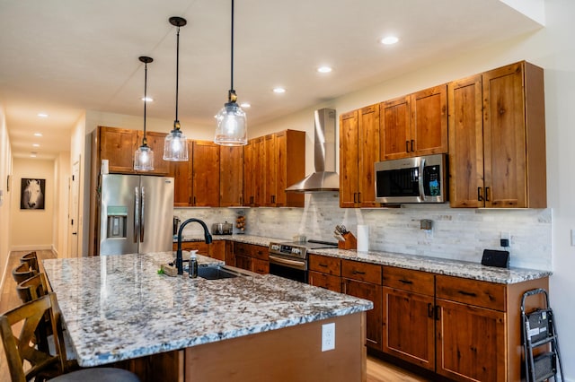 2634 Fitzgerald Ave, Fremont, MI 49412 - kitchen featuring appliances with stainless steel finishes, wall chimney range hood, a breakfast bar, light stone counters, and backsplash