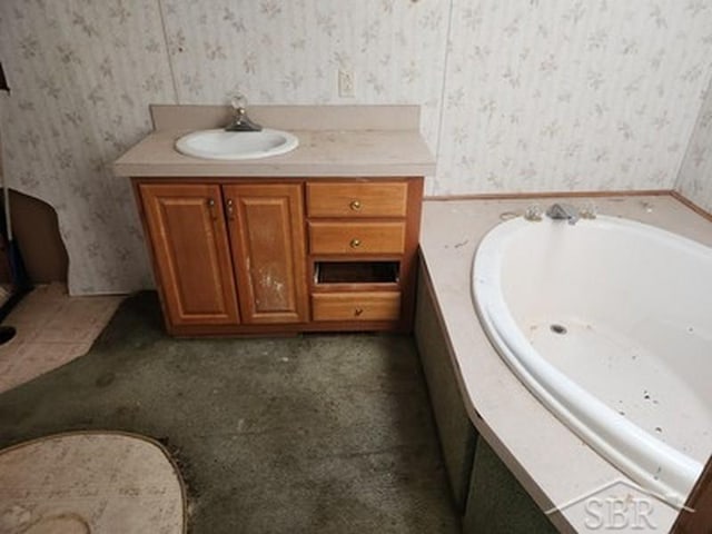 2502 Lynnwood Ave, Saginaw, MI 48601 - bathroom with wallpapered walls, a bath, and vanity