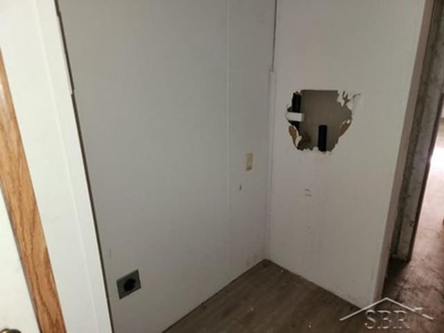 2502 Lynnwood Ave, Saginaw, MI 48601 - washroom featuring hookup for an electric dryer and dark wood-type flooring