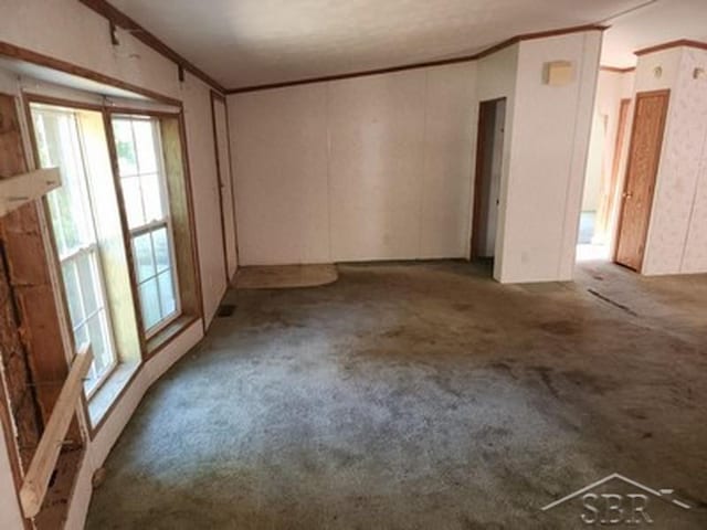 2502 Lynnwood Ave, Saginaw, MI 48601 - unfurnished room featuring carpet flooring and ornamental molding