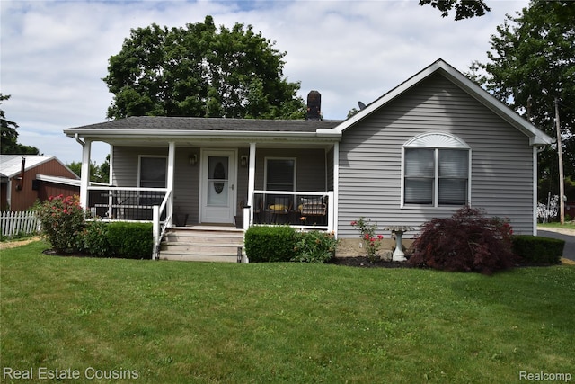 116 Park St, Gaines, MI 48436 - view of front of house with a front yard and covered porch