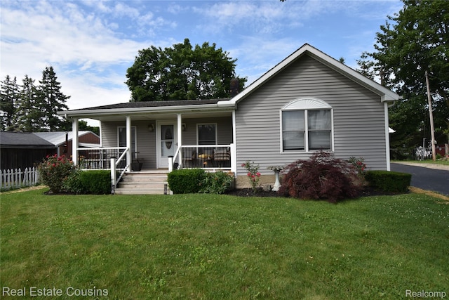 116 Park St, Gaines, MI 48436 - view of front of home with a front yard and a porch