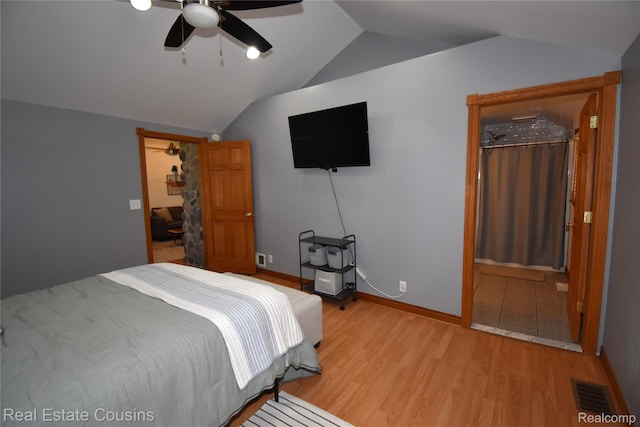 116 Park St, Gaines, MI 48436 - bedroom featuring vaulted ceiling, light wood-style floors, and ceiling fan