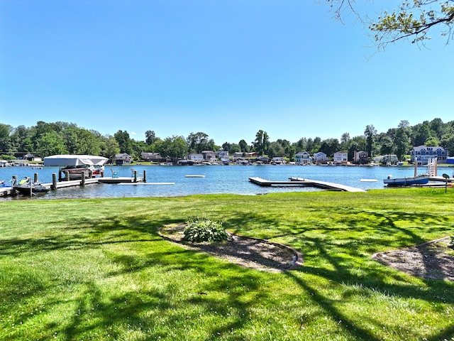 31467 Maple Island Rd, Dowagiac, MI 49047 - view of green lawn with a dock and a water view