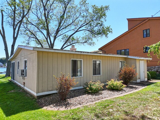 31467 Maple Island Rd, Dowagiac, MI 49047 - view of side of property with a chimney and a lawn