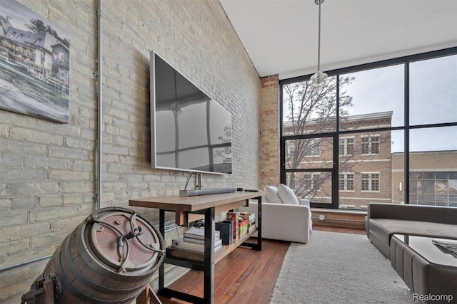 127 S Union St, Traverse City, MI 49684 - interior space with hardwood / wood-style flooring, a high ceiling, and a chandelier
