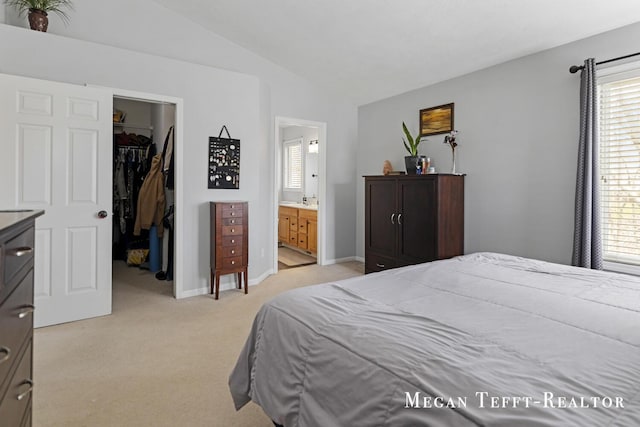 6641 Laguna Vista Dr NE, Rockford, MI 49341 - bedroom featuring lofted ceiling, a spacious closet, multiple windows, light colored carpet, and a closet