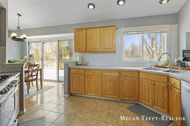 6641 Laguna Vista Dr NE, Rockford, MI 49341 - kitchen featuring stainless steel gas range, dishwashing machine, backsplash, healthy amount of natural light, and recessed lighting