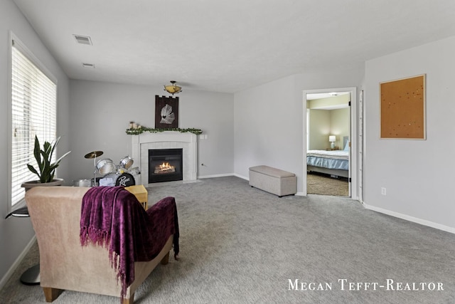 6641 Laguna Vista Dr NE, Rockford, MI 49341 - carpeted living area with a tiled fireplace and baseboards