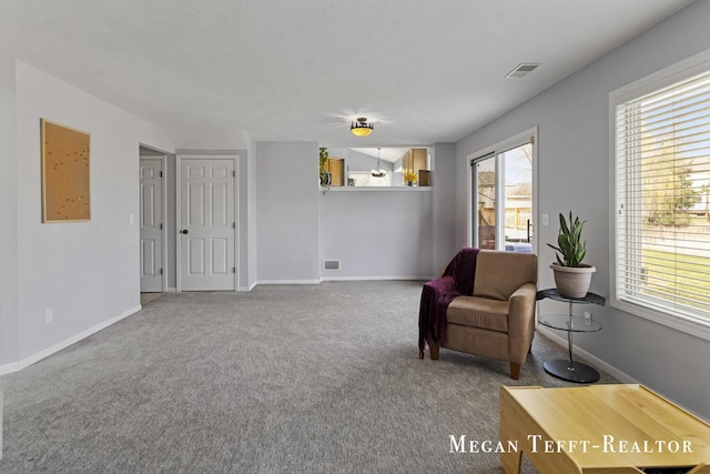 6641 Laguna Vista Dr NE, Rockford, MI 49341 - living area featuring carpet and baseboards