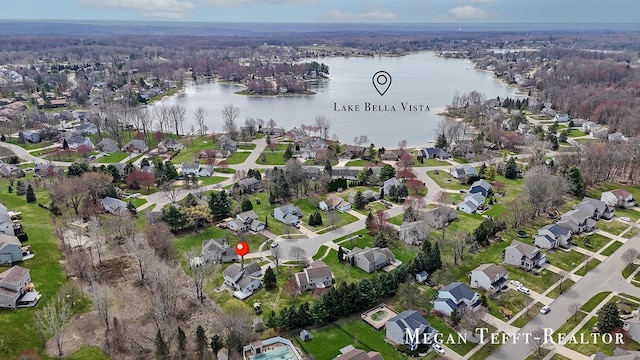 6641 Laguna Vista Dr NE, Rockford, MI 49341 - aerial view of property and surrounding area featuring a large body of water and nearby suburban area