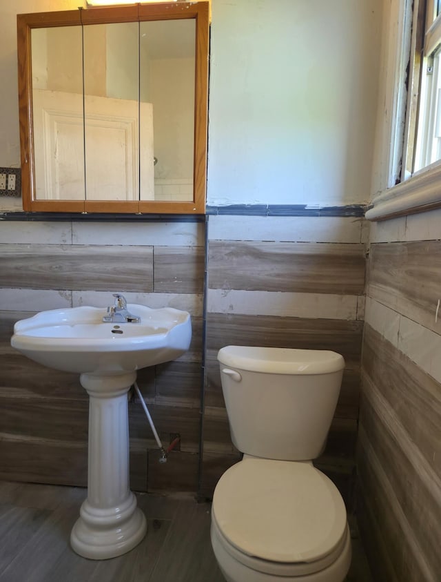3742 W Grand St, Detroit, MI 48238 - half bath featuring toilet and wood finished floors